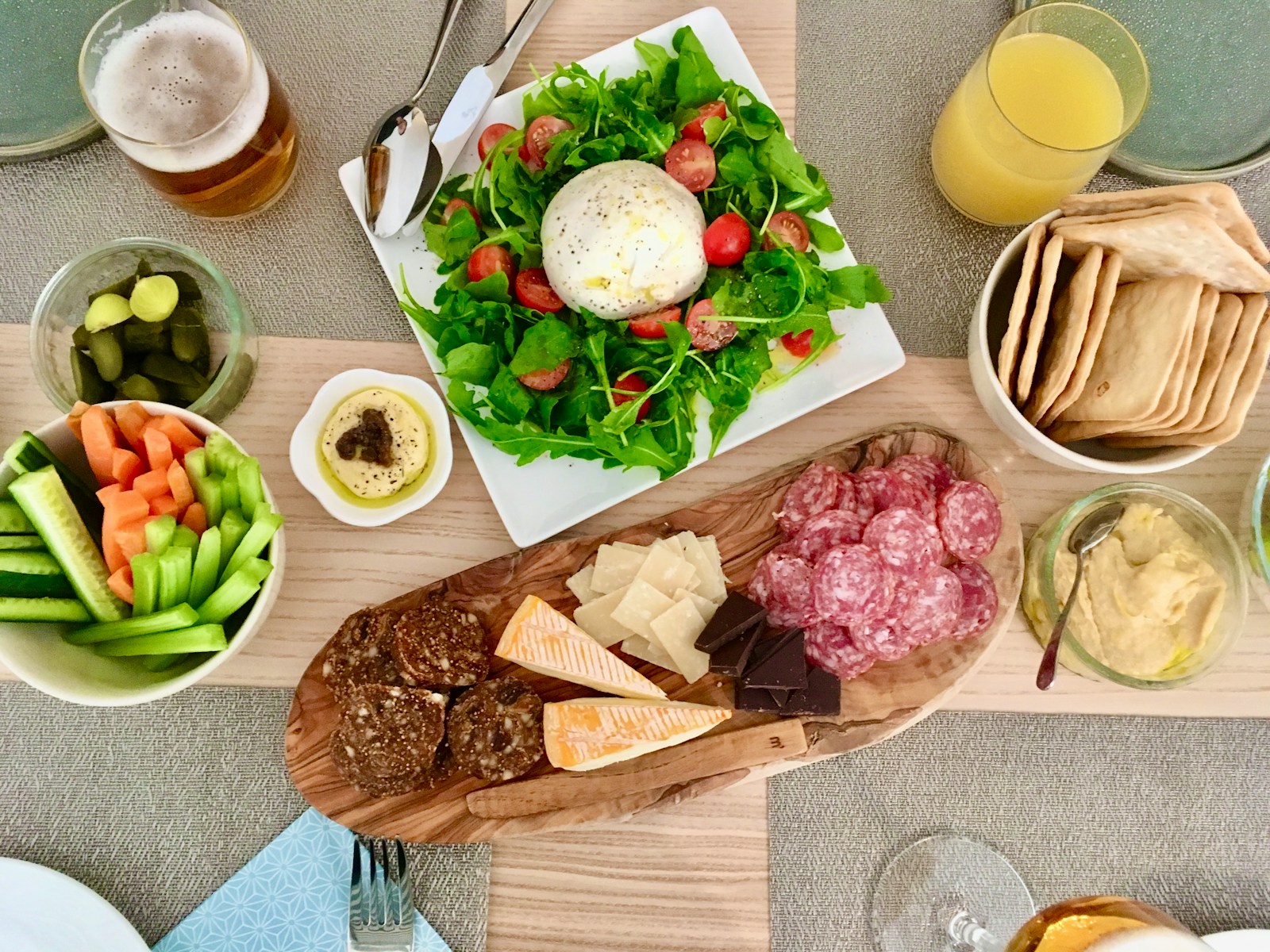 a table topped with plates of food and drinks